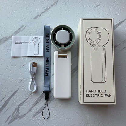 Bärbar handfläkt med hög hastighet 🌬️ Svalka direkt, snabb & smidig – får plats i väskan ⚡